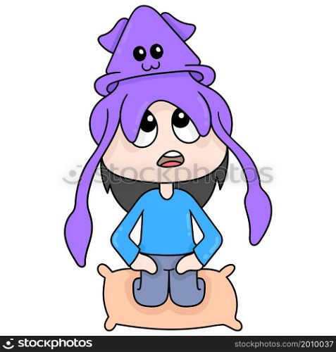 cute squid is on top of a sitting human head