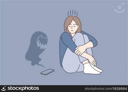 Cyberbullying and abuse in internet concept. Young sad depressed girl cartoon character sitting looking on smartphone with monster flying over it vector illustration . Cyberbullying and abuse in internet concept