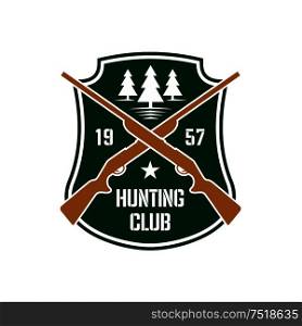 Dark green heraldic shield insignia with crossed hunting rifles and white silhouettes of fir trees, supplemented by foundation date and star. Hunting club or sporting contest design usage. Hunting insignia with crossed rifles on a shield