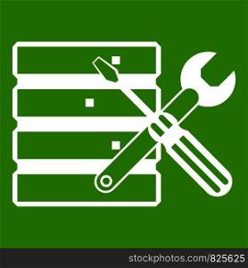 Database with screwdriverl and spanner icon white isolated on green background. Vector illustration. Database with screwdriverl and spanner icon green
