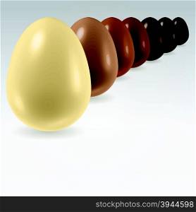 Different color chocolate eggs standing in a row from white to black over light background