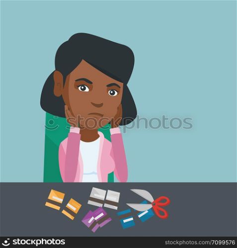 Disappointed african-american business woman cutting credit cards with scissors. Young depressed woman sitting at the table with cut credit cards. Vector cartoon illustration. Square layout.. Young african-american woman cutting credit cards.