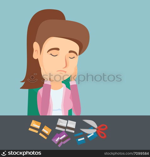 Disappointed caucasian business woman cutting credit cards with scissors. Young depressed woman sitting at the table with cut credit card. Vector cartoon illustration. Square layout.. Young caucasian woman cutting credit cards.