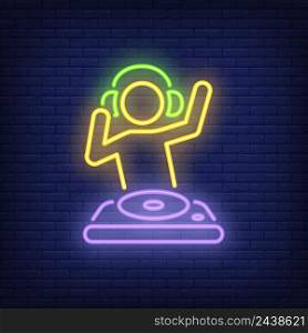Disk jokey with dj mixer neon sign. Music, party and sound concept. Advertisement design. Night bright neon sign, colorful billboard, light banner. Vector illustration in neon style.