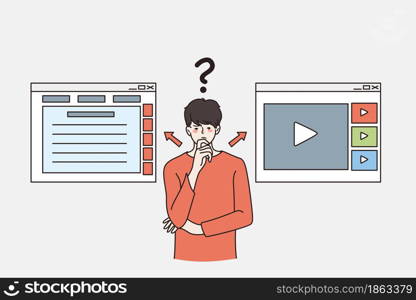Distance education and making choice concept. Young frustrated man standing thinking choosing between Digital online select education on the via mobile application or video in internet . Distance education and making choice concept