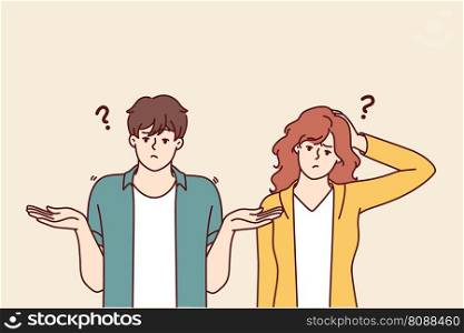 Doubting man and woman shrug hands and touch heads, sign of absence of solution to problem. Doubtful couple of guy and girl experiencing embarrassment do not understand what is happening . Doubting man and woman shrug hands and touch heads, sign of absence of solution to problem