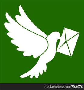 Dove carrying envelope icon white isolated on green background. Vector illustration. Dove carrying envelope icon green