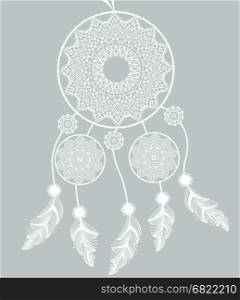 Dreamcatcher . Dreamcatcher with feathers on a gray background