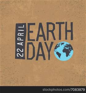 Earth day, 22 April text with globe symbol on cardboard texture background.