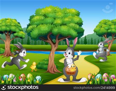 Easter background with bunnies and baby chick on the nature
