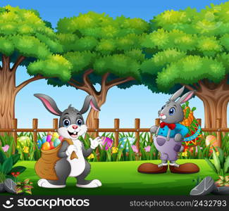 Easter bunnies and colorful egg on the garden