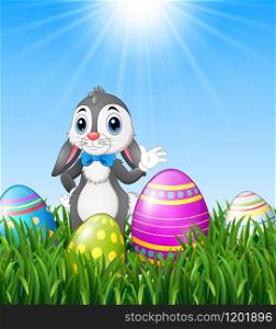 Easter bunny cartoon waving with easter eggs in the grass background