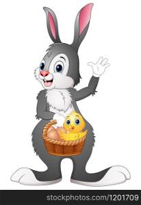 Easter bunny holding a basket with easter egg and chick