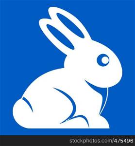 Easter bunny icon white isolated on blue background vector illustration. Easter bunny icon white
