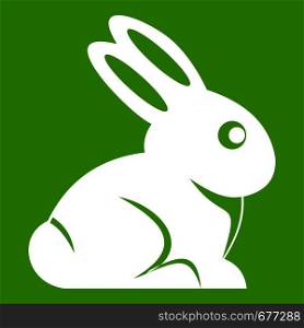 Easter bunny icon white isolated on green background. Vector illustration. Easter bunny icon green
