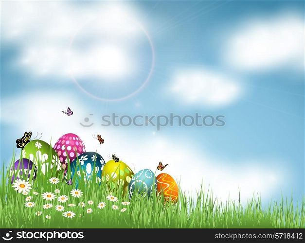 Easter eggs nestled in grass against a blue sky with butterflies