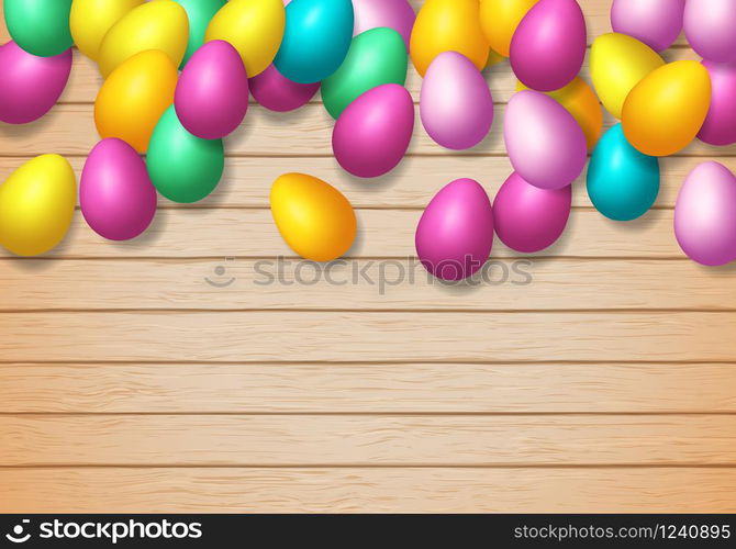 Easter frame with shiny colorful eggs spread over wooden background