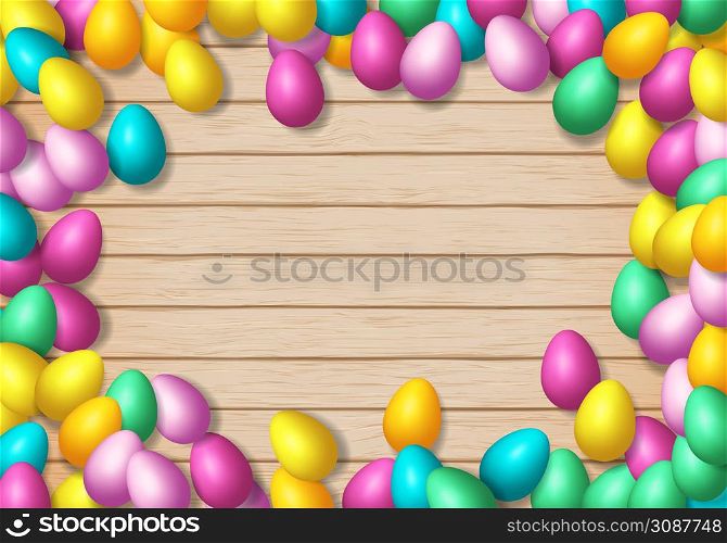 Easter frame with shiny colorful eggs spread over wooden background