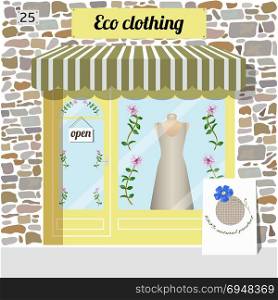 Eco clothing shop. Organic clothes store.. Eco clothing shop building. Facade of stone. Dress in the window. Vector illustration EPS10