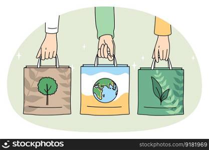 Ecology care and eco-friendly things concept. Human hands holding eco-friendly bags with pictures of plant planet and tree vector illustration. Ecology care and eco-friendly things concept.