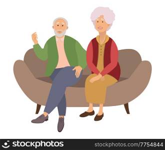 Elderly couple sitting on the sofa at home isolated on white background. Retired elderly couple. Grandparents family, grandmother and grandfather happy friends sitting on the couch communicating. Elderly couple sitting on the sofa at home isolated on white background. Retired elderly couple