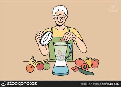 Elderly man uses blender and prepares smoothies from fresh fruits and vegetables in order to stay healthy. Retired man prepares smoothies and follows vitamin diet prescribed by nutritionist doctor. Elderly man uses blender and prepares smoothies from fresh fruits and vegetables