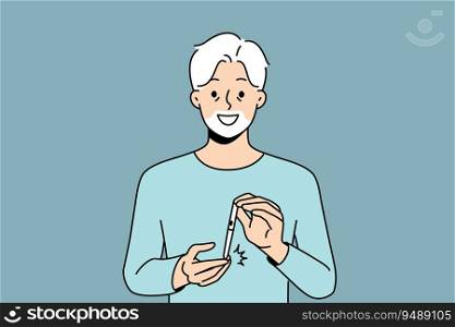 Elderly man uses glucometer to measure level insulin in blood and smiles, rejoicing at easing diabetes. Gray-haired grandfather with glucometer recommends fighting diabetes and taking care of health. Elderly man uses glucometer to measure level insulin in blood, rejoicing at easing of diabetes.