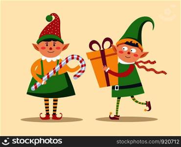 Elf children holding presents decorated with bow and candy vector. Leprechaun boys wearing traditional clothes with hats and boots. Santa Claus helpers with lollipop and gift in wrapping with ribbons. Elf children holding presents decorated with bow and candy