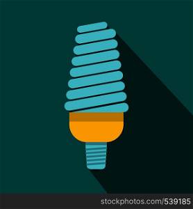 Energy saving bulb icon in flat style on a blue background. Energy saving bulb icon, flat style