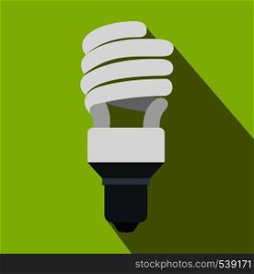 Energy saving bulb icon in flat style on a green background. Energy saving bulb icon, flat style