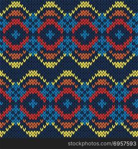 Ethnic motley background in red, yellow, orange and blue colours, seamless knitting vector pattern as a fabric texture. Ethnic seamless knitted color pattern