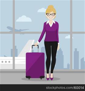 Executive female walking with her suitcase at the airport