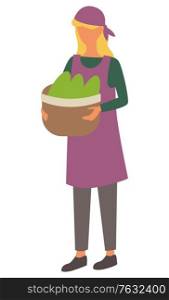 Female character carrying harvested fruits and veggies in basket, isolated woman with hat on head. Farming personage with organic meal production. Vector illustration in flat cartoon style. Woman with Basket and Gathered Greenery Vector