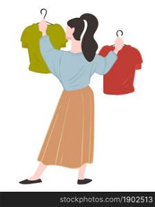 Female character shopping in store or shop choosing clothes hanging on hangers. Woman following trends buying fashionable trendy clothing. Purchase of lady consumer and buyer. Vector in flat style. Shopping woman choosing clothes on hanger in store