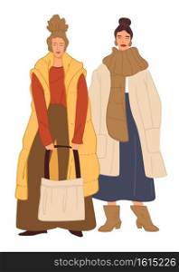 Female characters wearing fashionable and trendy clothes. Ladies in winter outfits with jackets and sweaters, scarves and bags. Stylish ladies, shopping in shop or store. Vector in flat style. Fashionable elegant women in winter clothes vector