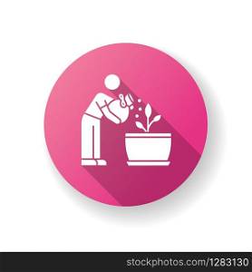 Fertilizing seedling pink flat design long shadow glyph icon. Feeding sapling. Houseplant care. Planting process. Indoor gardening. Growth supplements, amendments. Silhouette RGB color illustration
