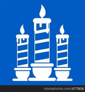 Festive candles icon white isolated on blue background vector illustration. Festive candles icon white