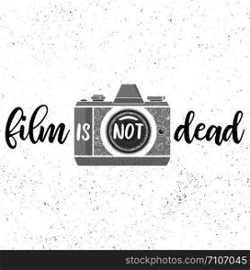 Film is not dead.Black and white print with film photocamera on grunge background. Film is not dead.Black and white print with film photocamera on grunge background.