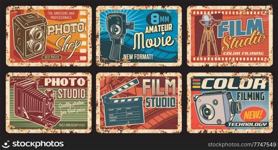 Film studio rusty metal plates, movie retro vector posters with vintage photo and video camera, film reel and clapper. Cinema, cinematography entertainment industry ferruginous cards, old camcorders. Film studio rusty metal plates, vector posters set