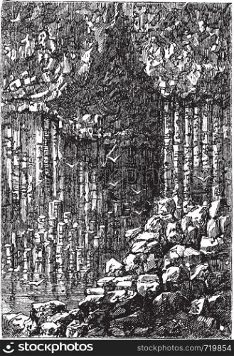 Fingal's Cave in Staffa, Scotland, United Kingdom, during the 1890s, vintage engraving. Old engraved illustration of the entrance to Fingal's Cave.