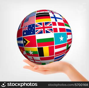 Flags of the world in globe and hand. Vector illustration.