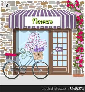 Flower shop building facade of stone. Flower shop building facade of stone. Bicycle with flowers in a basket. Rose sticker on the window. Climbing rose near the door. Vector illustration.