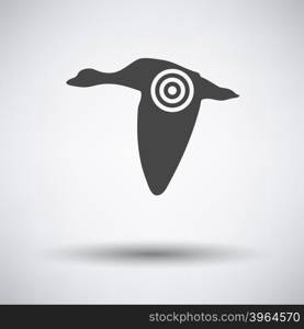Flying duck silhouette with target icon on gray background with round shadow. Vector illustration.
