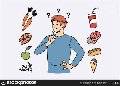 Food and diet choice concept. Young smiling man cartoon character standing trying to choose between healthy food and fat junk fast foods . Food and diet choice concept.