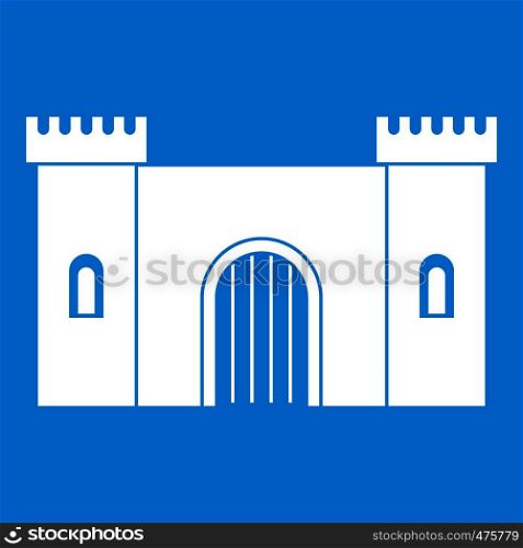 Fortress with gate icon white isolated on blue background vector illustration. Fortress with gate icon white