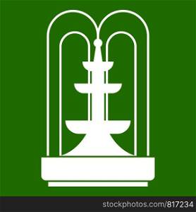 Fountain icon white isolated on green background. Vector illustration. Fountain icon green