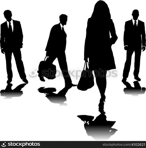 four business people in silhouette walking in different directions