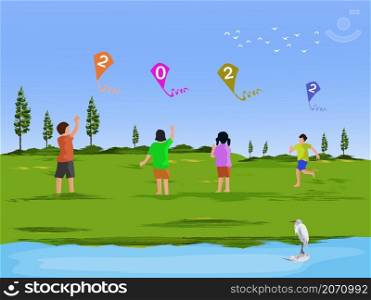 Four children are playing a kite with a 2022 figure in a field . There are forest and the blue sky background.