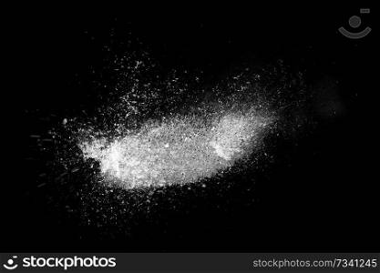 Freeze motion of white powder exploding, isolated on black, dark background. Abstract design of dust cloud. Particles explosion, screen saver wallpaper with copy space. 