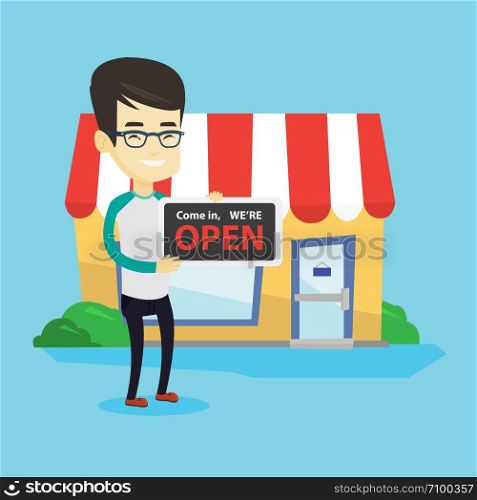 Friendly asian shop owner holding an open signboard. Cheerful smiling shop owner standing in front of small store. Man inviting to come in his shop. Vector flat design illustration. Square layout.. Asian shop owner holding open signboard.